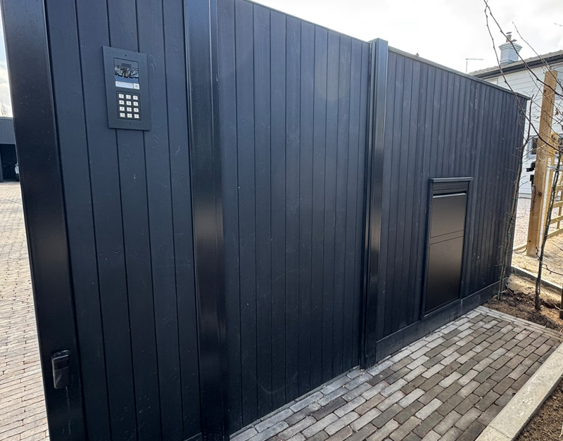 Metal framed gate with keypad and parcel box